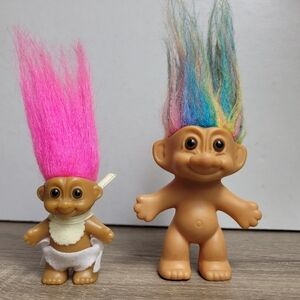 Small rainbow and baby Russ Troll dolls